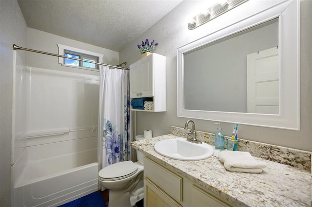 full bath with toilet, shower / bath combo, vanity, and a textured ceiling