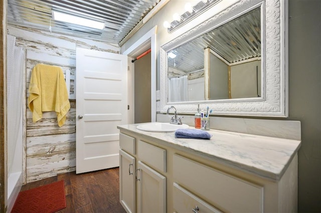 bathroom featuring wood finished floors, vanity, and a shower with curtain