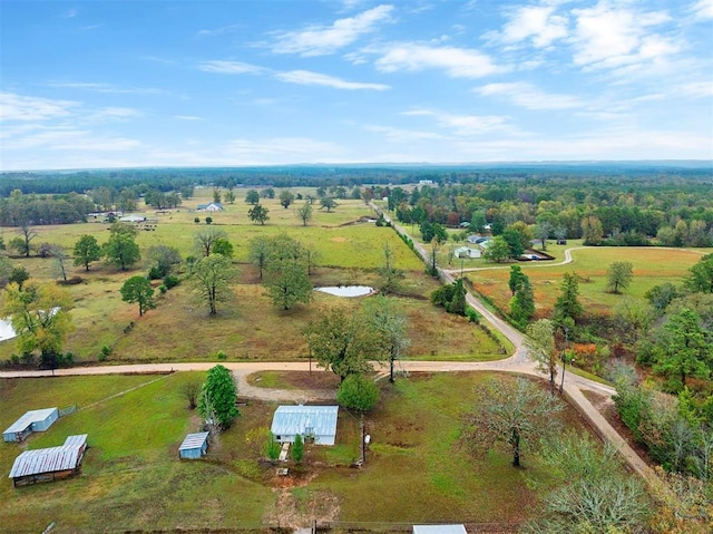 birds eye view of property with a rural view