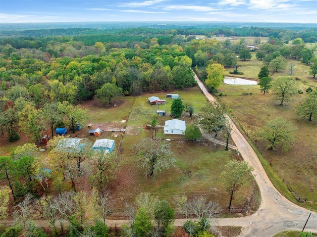 drone / aerial view featuring a forest view