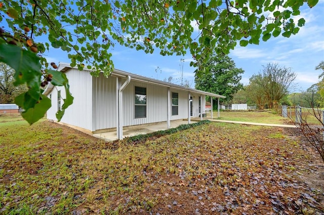 ranch-style house with fence and a patio