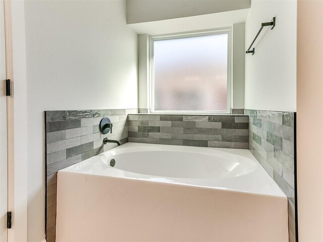 bathroom with a tub to relax in