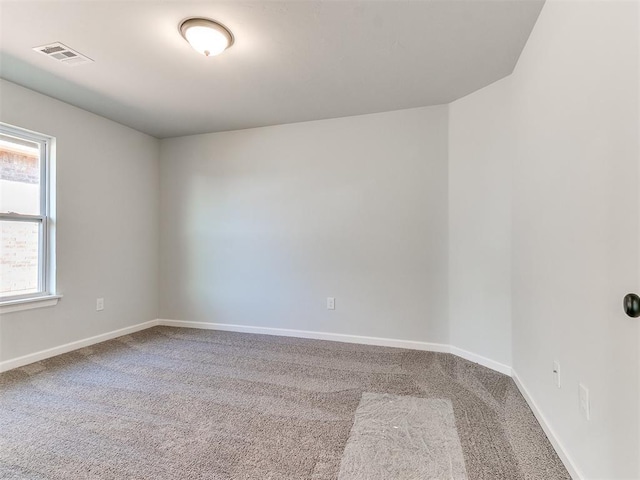 unfurnished room with carpet floors