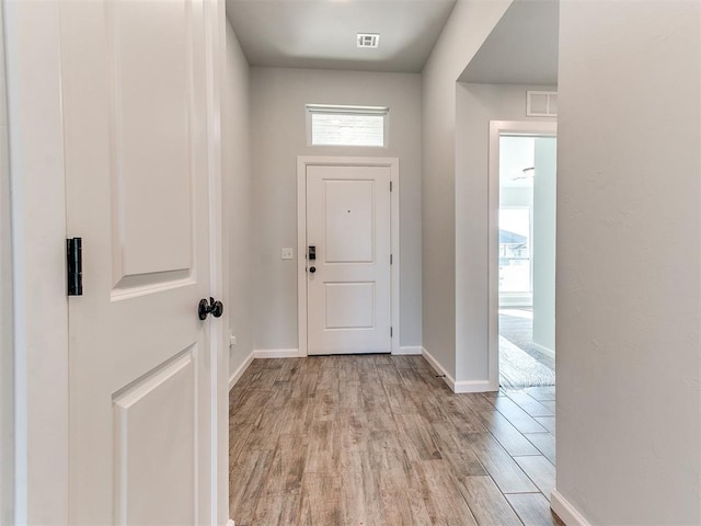 doorway with light hardwood / wood-style flooring