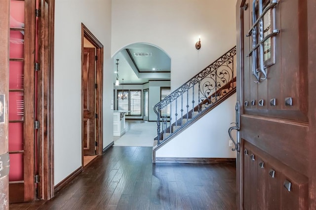 foyer entrance featuring dark hardwood / wood-style floors