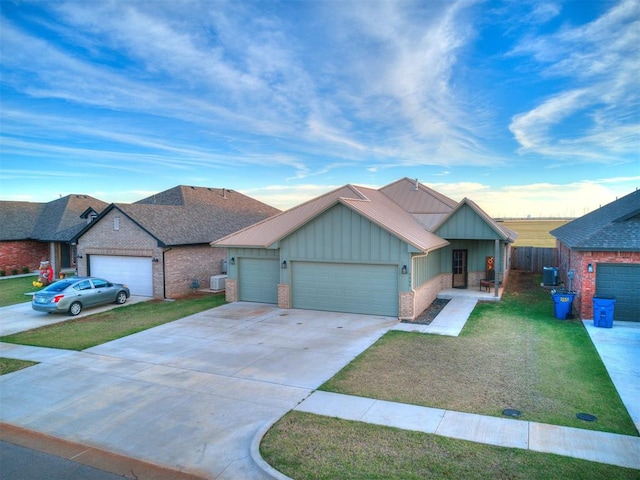 view of front of home with a garage and a front yard