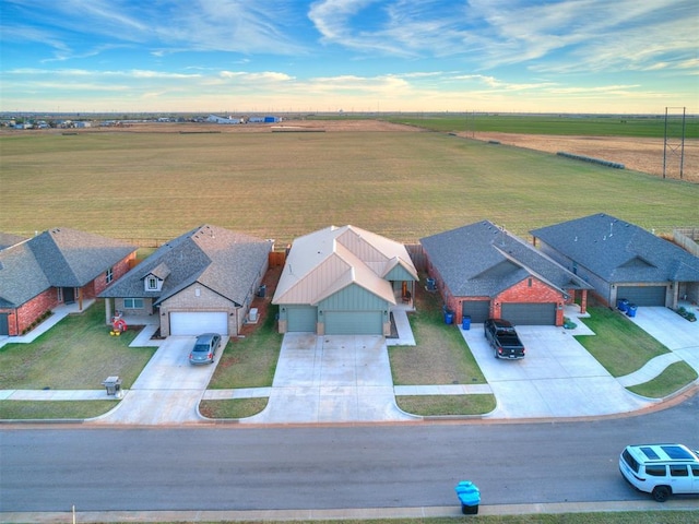 aerial view at dusk featuring a rural view