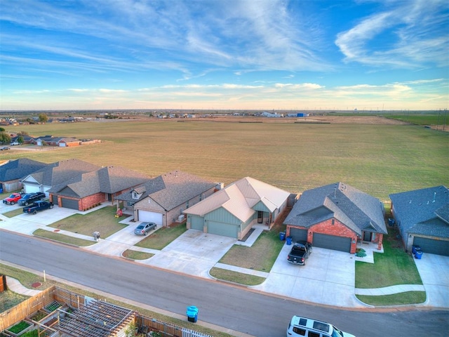 birds eye view of property with a rural view