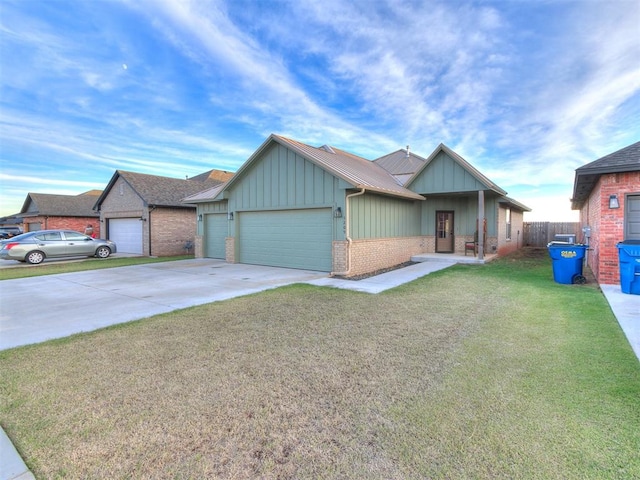 view of front of property with a front lawn and a garage