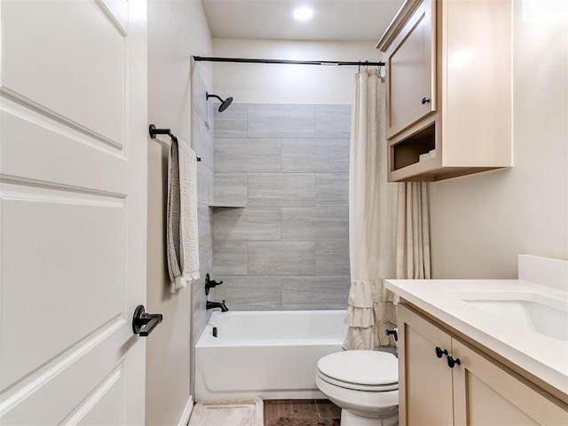 full bathroom with vanity, hardwood / wood-style flooring, toilet, and shower / bath combo with shower curtain