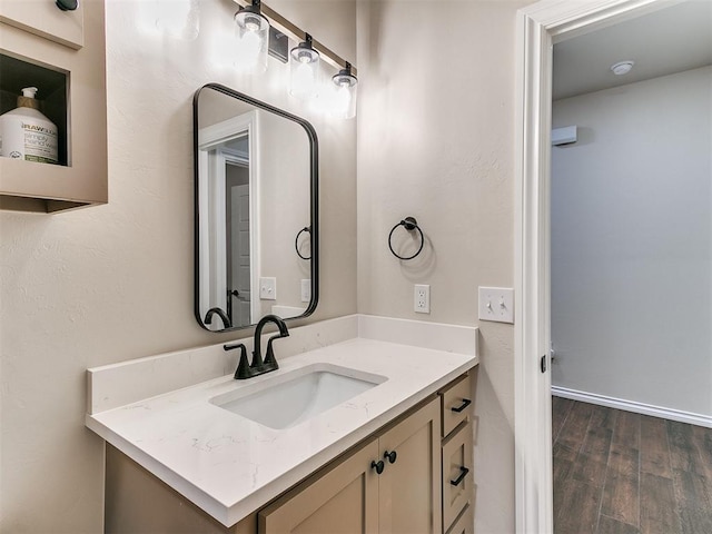 bathroom featuring hardwood / wood-style floors and vanity