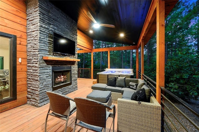 wooden terrace featuring an outdoor living space with a fireplace