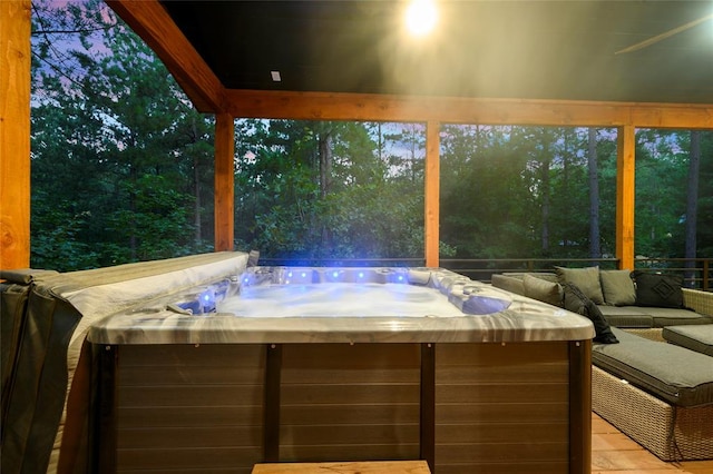 patio terrace at dusk with a hot tub