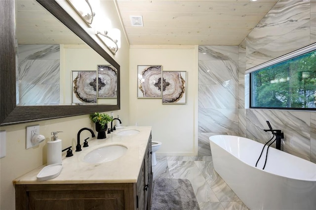 bathroom with vanity, tile walls, wooden ceiling, toilet, and a tub