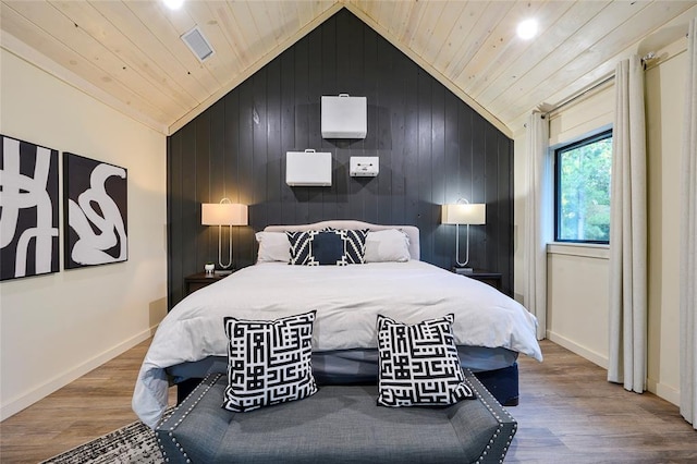 bedroom featuring hardwood / wood-style floors, wooden ceiling, and wood walls