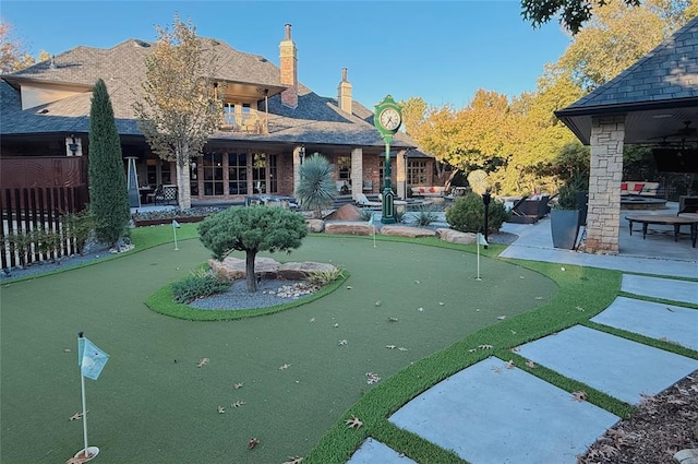 rear view of property featuring a patio area