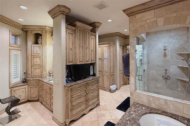 bathroom with tile patterned floors, vanity, crown molding, and plus walk in shower