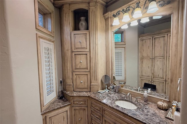 bathroom with vanity and crown molding