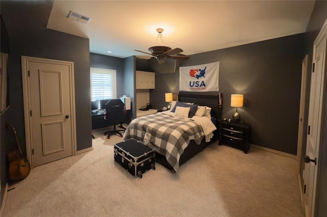 bedroom featuring ceiling fan and light colored carpet