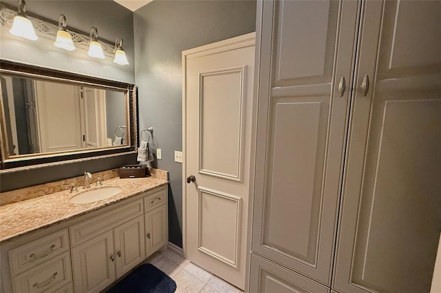 bathroom with tile patterned floors and vanity