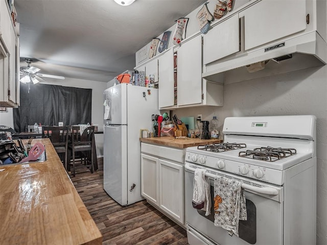 kitchen with white appliances, dark wood-type flooring, wooden counters, ceiling fan, and white cabinetry