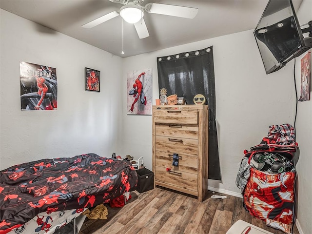 bedroom featuring hardwood / wood-style floors and ceiling fan