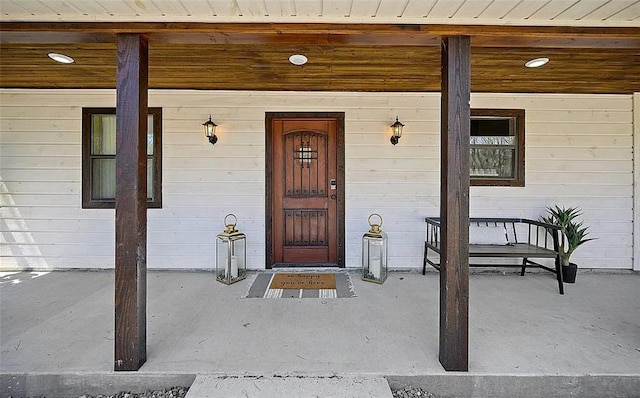 doorway to property featuring covered porch