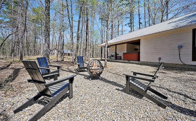 view of yard featuring an outdoor fire pit