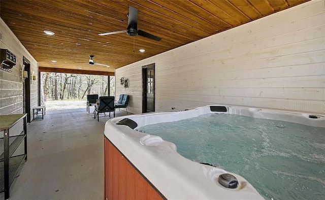 view of patio / terrace with a hot tub and ceiling fan