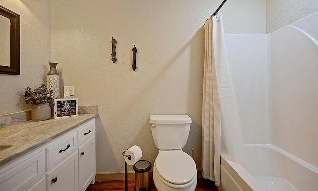 full bathroom featuring shower / bath combo with shower curtain, vanity, wood-type flooring, and toilet