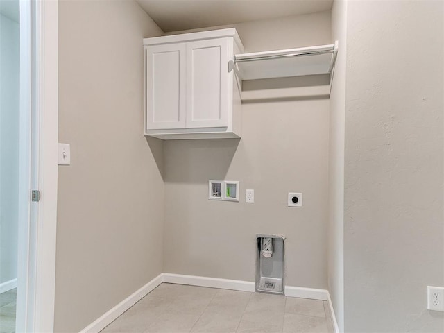 laundry room featuring hookup for a washing machine, light tile patterned floors, cabinets, and hookup for an electric dryer