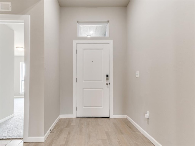 doorway to outside featuring light wood-type flooring