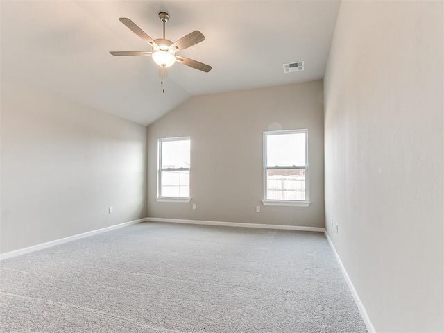 unfurnished room with ceiling fan, light carpet, and lofted ceiling