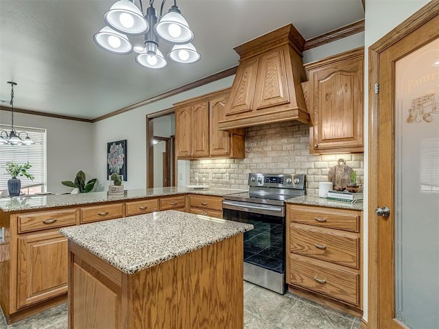 kitchen featuring pendant lighting, stainless steel electric range, a center island, custom exhaust hood, and a chandelier