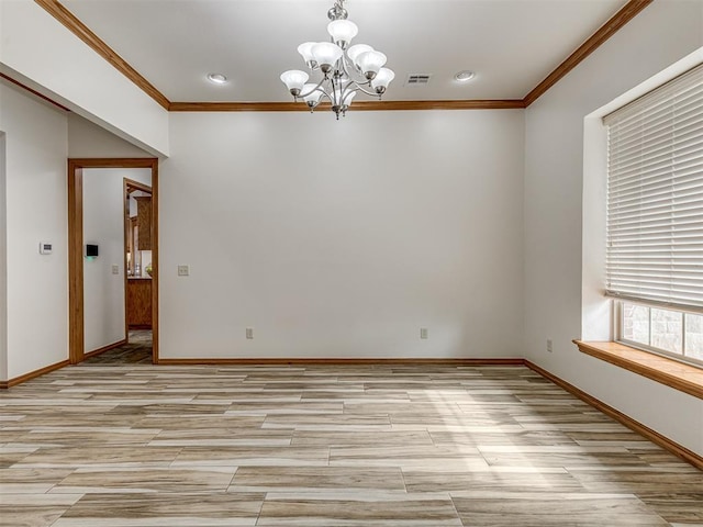 spare room featuring a chandelier, light hardwood / wood-style floors, and ornamental molding