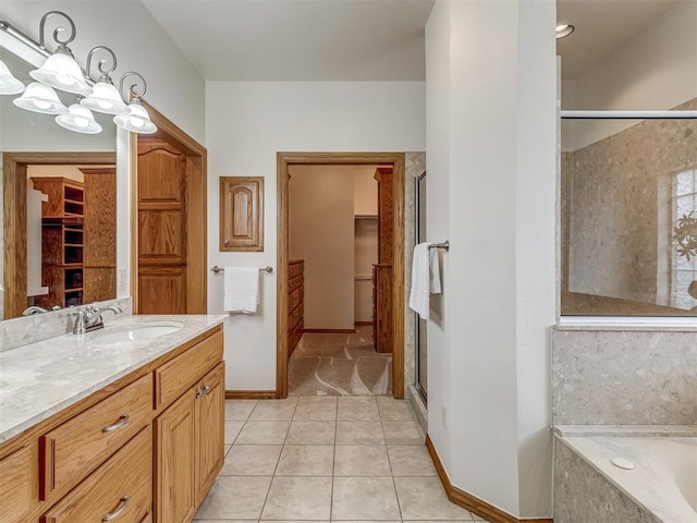 bathroom featuring tile patterned floors, separate shower and tub, and vanity