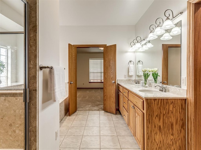 bathroom with tile patterned floors, vanity, and a shower with shower door