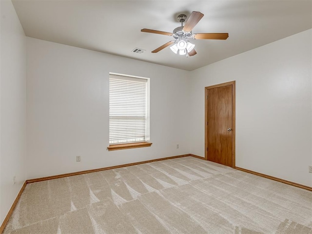 carpeted empty room with ceiling fan