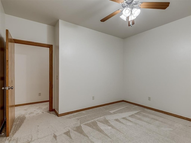 unfurnished room featuring ceiling fan and light colored carpet