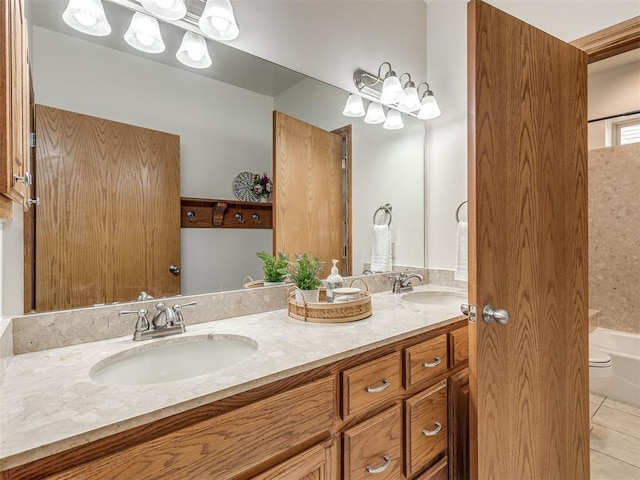 bathroom featuring tile patterned flooring and vanity