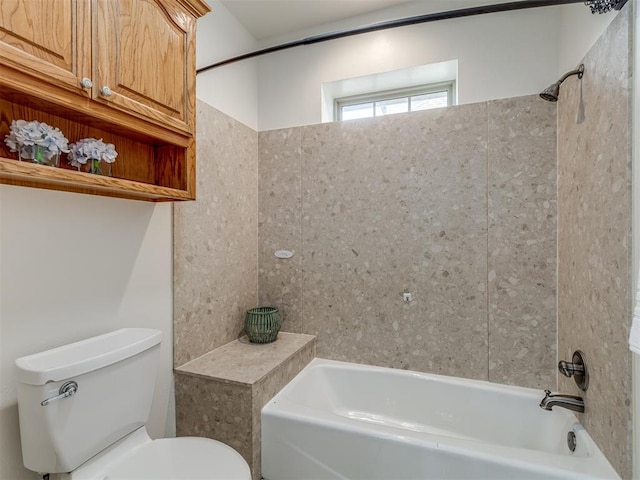 bathroom featuring washtub / shower combination and toilet