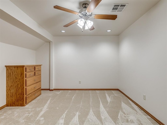 additional living space featuring ceiling fan and light carpet