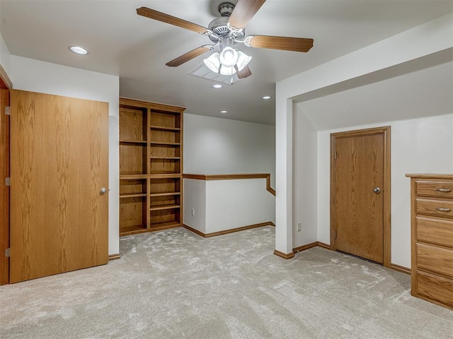 unfurnished bedroom with light carpet and ceiling fan