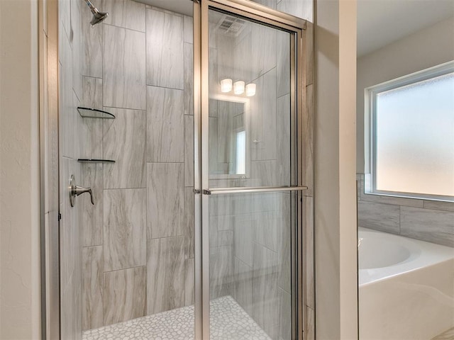 bathroom featuring plus walk in shower