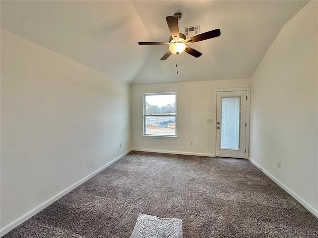 carpeted spare room with ceiling fan and lofted ceiling