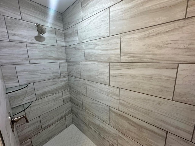 bathroom with a tile shower