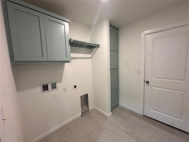 washroom featuring hookup for a washing machine, cabinets, and hookup for an electric dryer