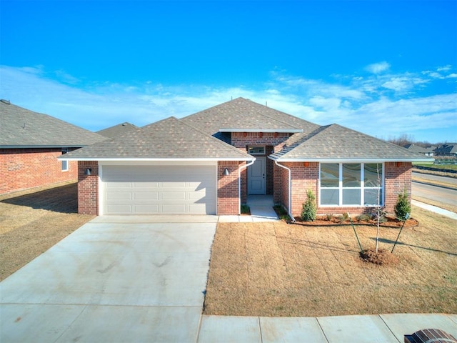 ranch-style home with a front yard and a garage