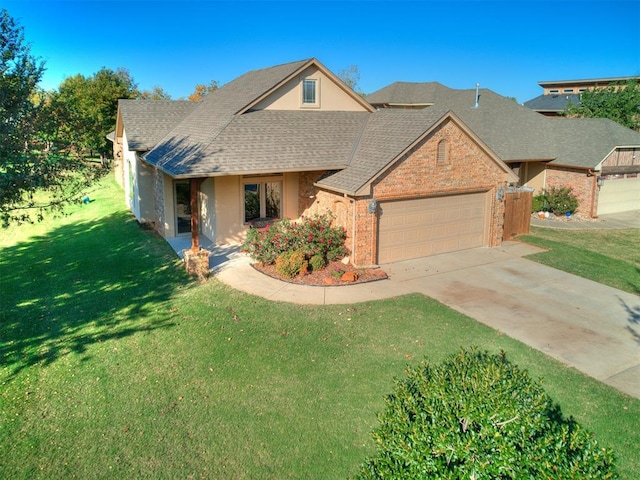 view of front facade featuring a front yard and a garage