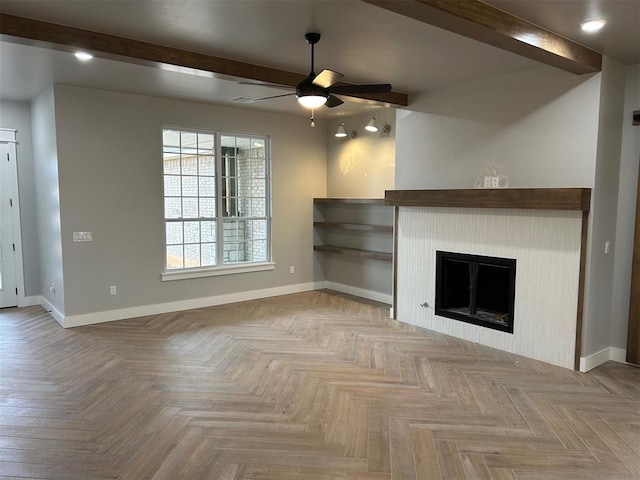 unfurnished living room with beam ceiling, ceiling fan, and light parquet floors